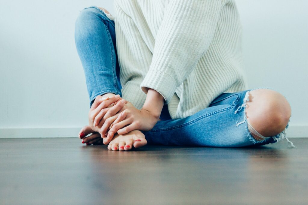person wearing distressed blue denim jeans inside room - How Gut Health Affects Mental Health?