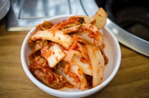 Delicious Kimchi in White Ceramic Bowl