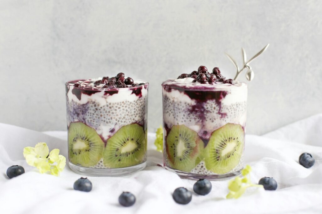 two fruit beverages on glass cups with chia seeds