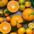 orange fruits on gray wooden surface